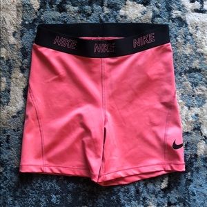 Pink Nike DRI-FIT spandex shorts